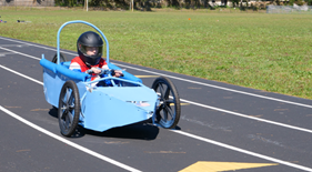 Student races the car he built in the Engineering Magnet program. Student races the car he built in the Engineering Magnet program.